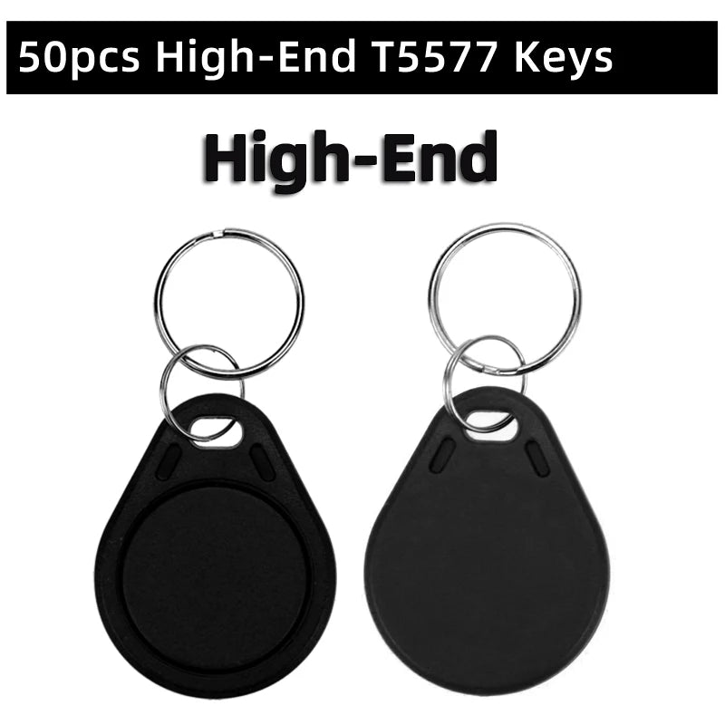 Two black plastic T5577 RFID key fob tags with metal key rings on a white background.