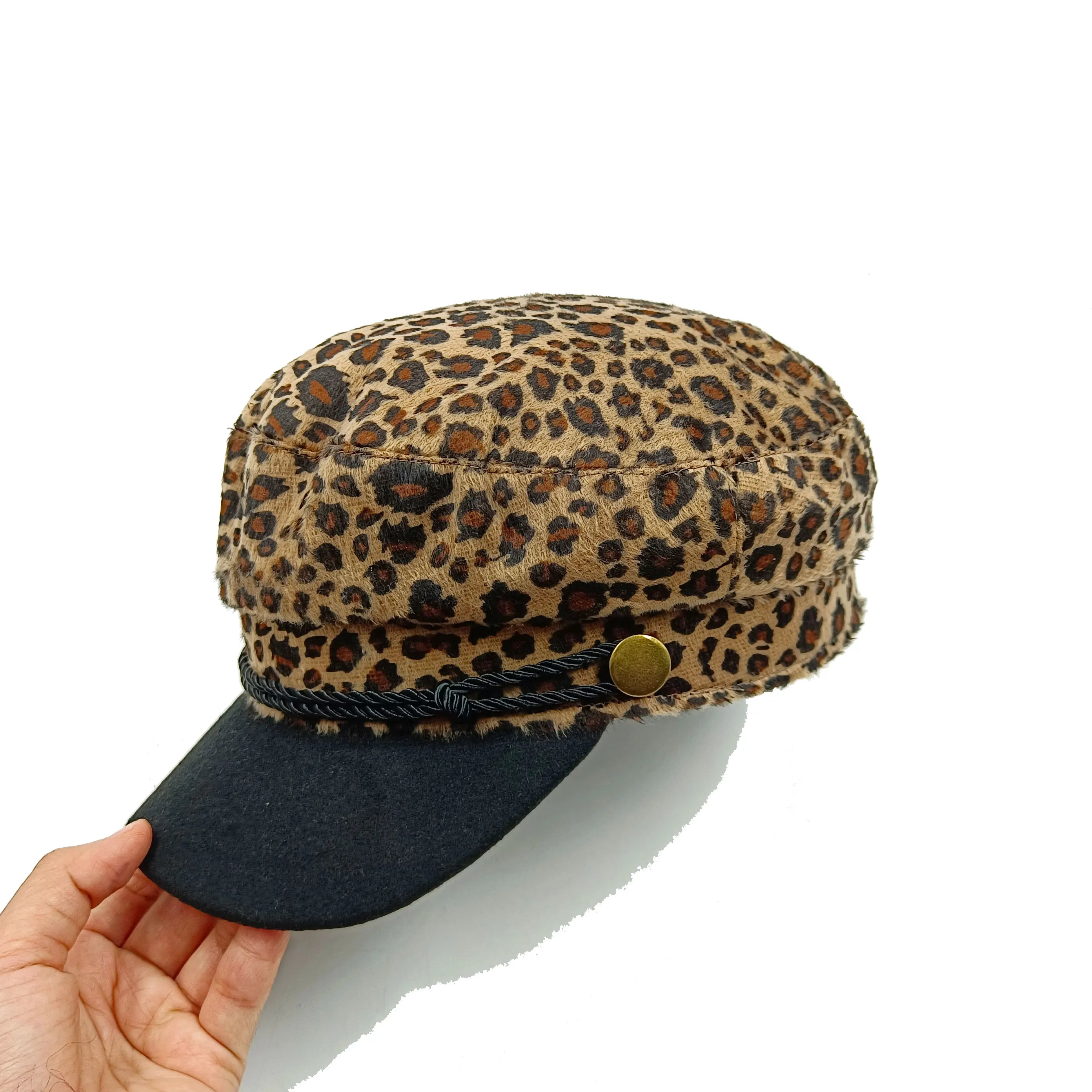 Leopard-print retro beret hat with a black peak, decorative rope trim and a gold-tone button detail.