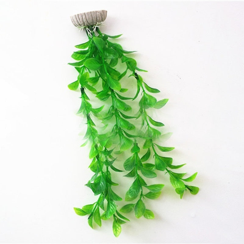 Artificial aquarium plant with cascading bright green leaves attached to a weighted grey stone base.