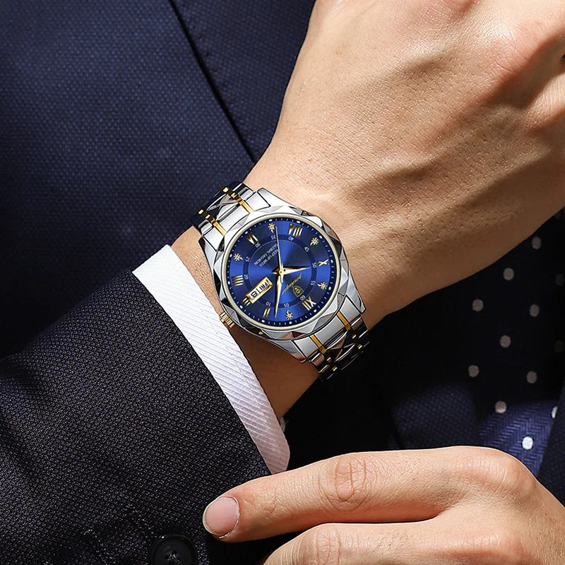 POEDAGAR silver and gold stainless steel men's watch with a round blue dial and date display on a wrist.