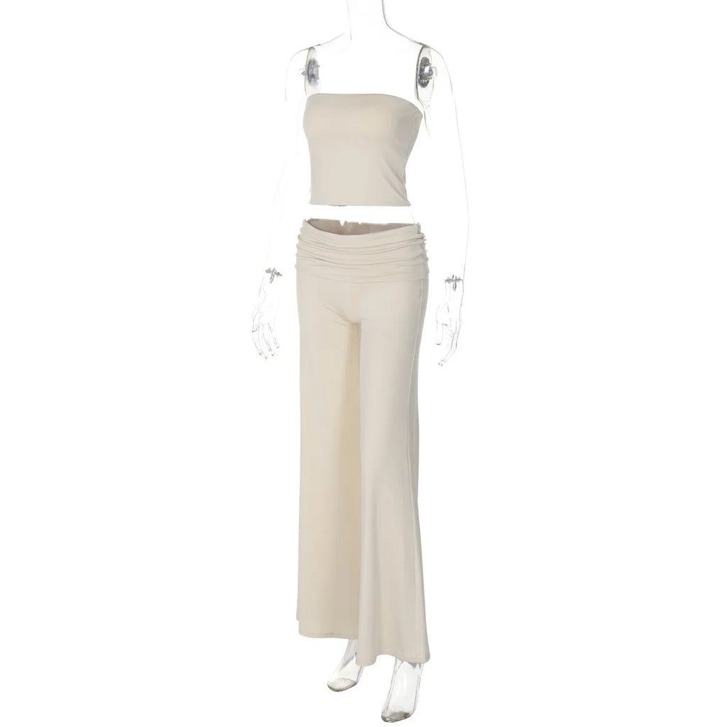 Cream two-piece set featuring a strapless crop top and high-waisted, wide-leg trousers with a ruched fold-over waist.
