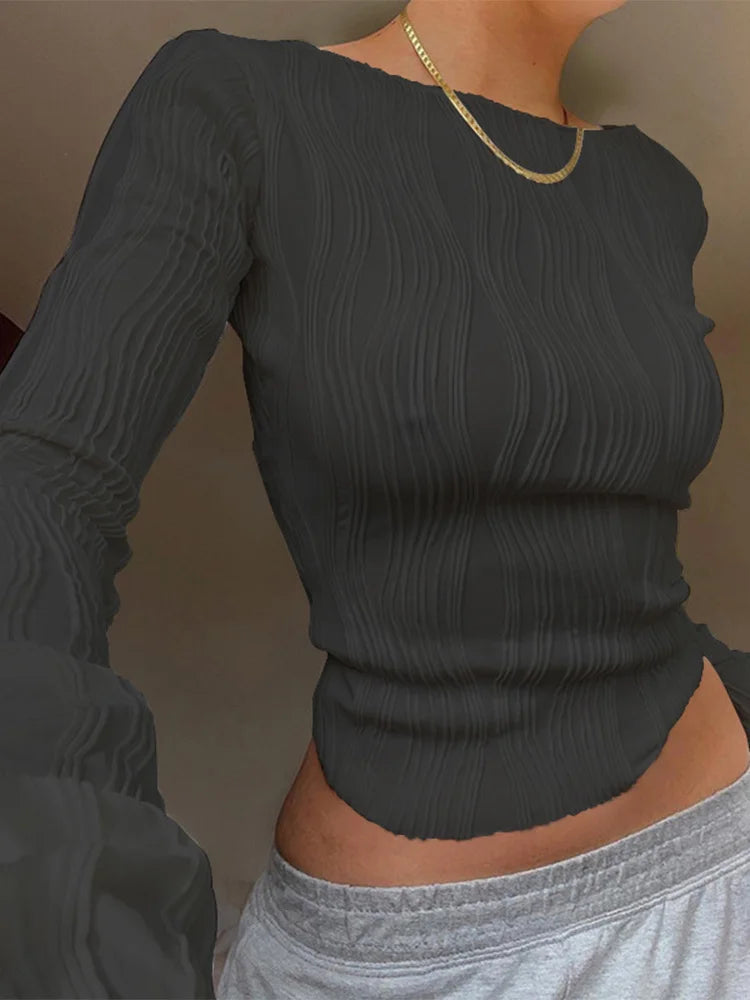 Charcoal grey, long-sleeved, slim-fit top with a textured, vertically ribbed fabric and round neckline.