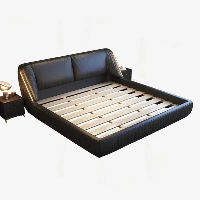 Modern king-size bed frame in black leather with a plush, curved headboard and wooden slatted base.