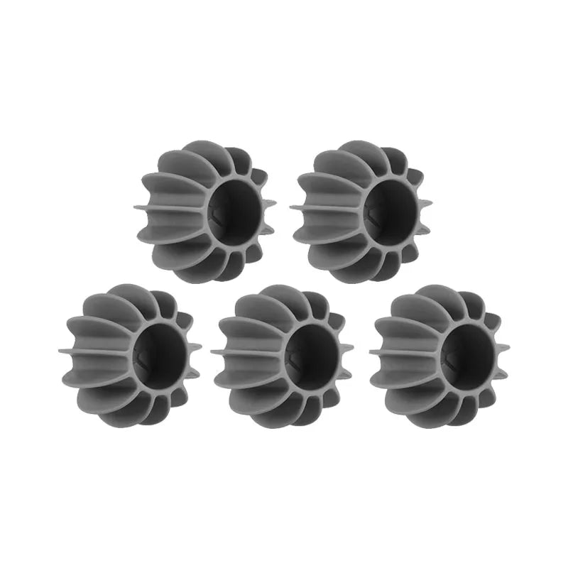 Five grey, flower-shaped silicone laundry dryer balls arranged in two rows on a white background.