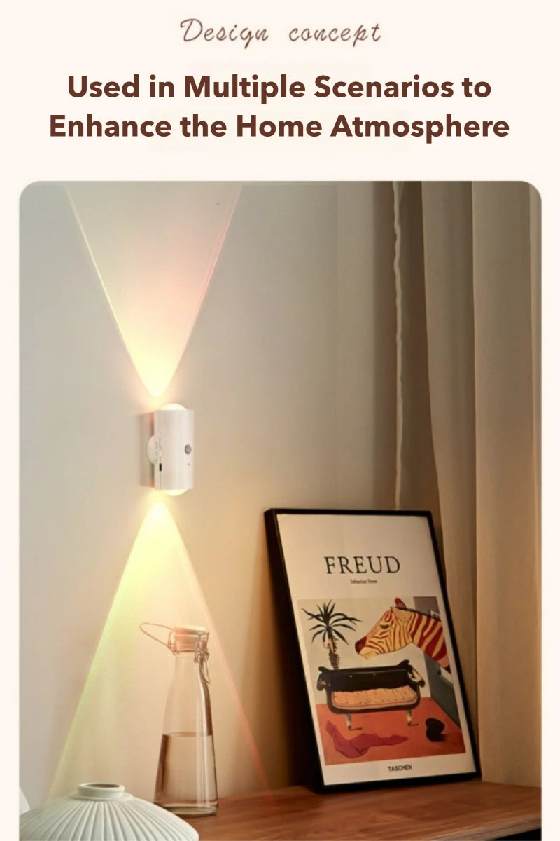 A sleek white rechargeable wall lamp casting upward and downward multicoloured ambient light beams against a wall.