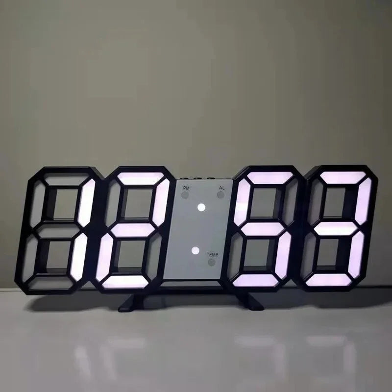 Modern black digital LED alarm clock with large, glowing white numbers on a desk stand.