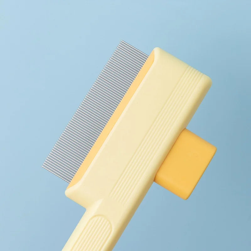 A pale yellow pet grooming comb with fine, vertical stainless steel teeth on a light blue background.