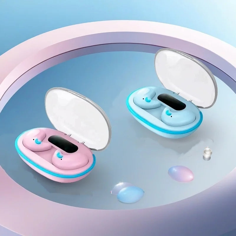 Two open wireless earbud cases in pastel pink and blue, featuring a digital display, resting on a reflective surface.