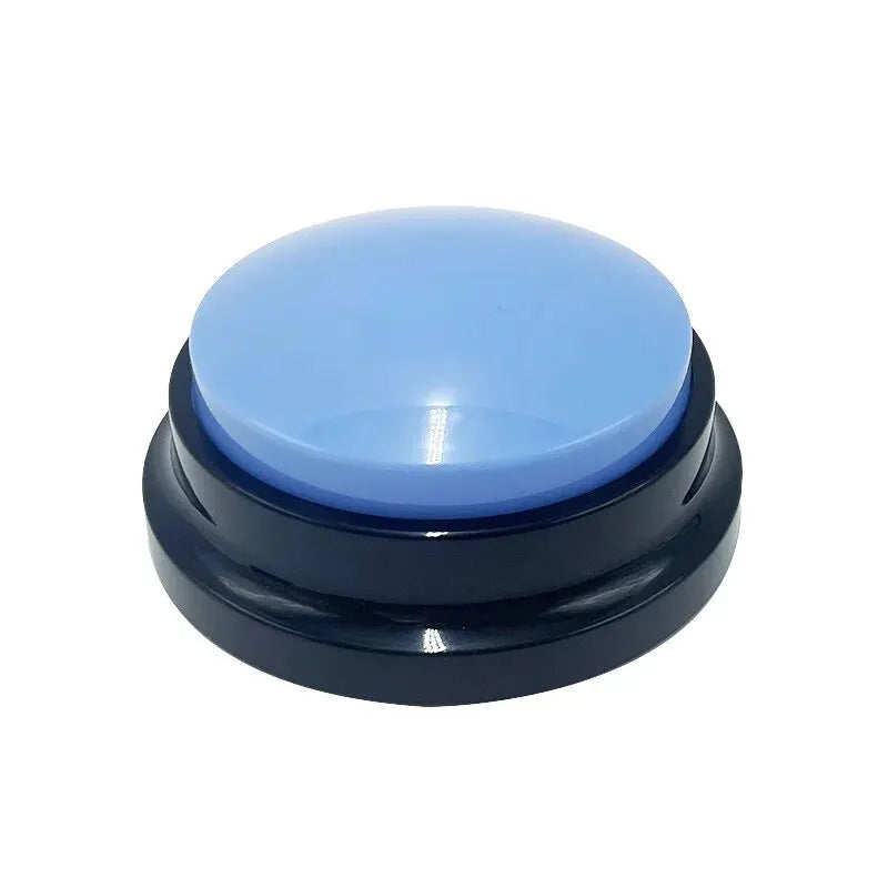 A round, interactive dog training button with a light blue dome and a sturdy, black circular base.