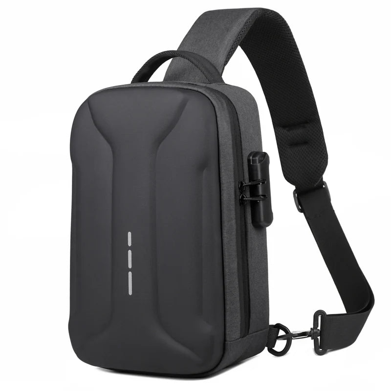 Dark grey, anti-theft crossbody bag with a hard-shell front, lockable zip, and comfortable padded shoulder strap.