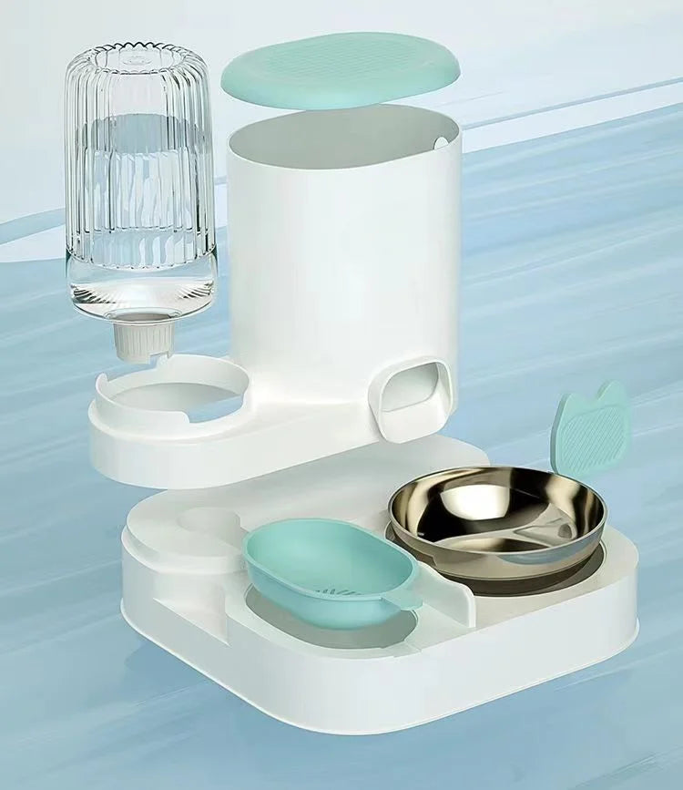 Modern white and mint green automatic pet feeder with a detachable water bottle, feeding bowl, and scoop.