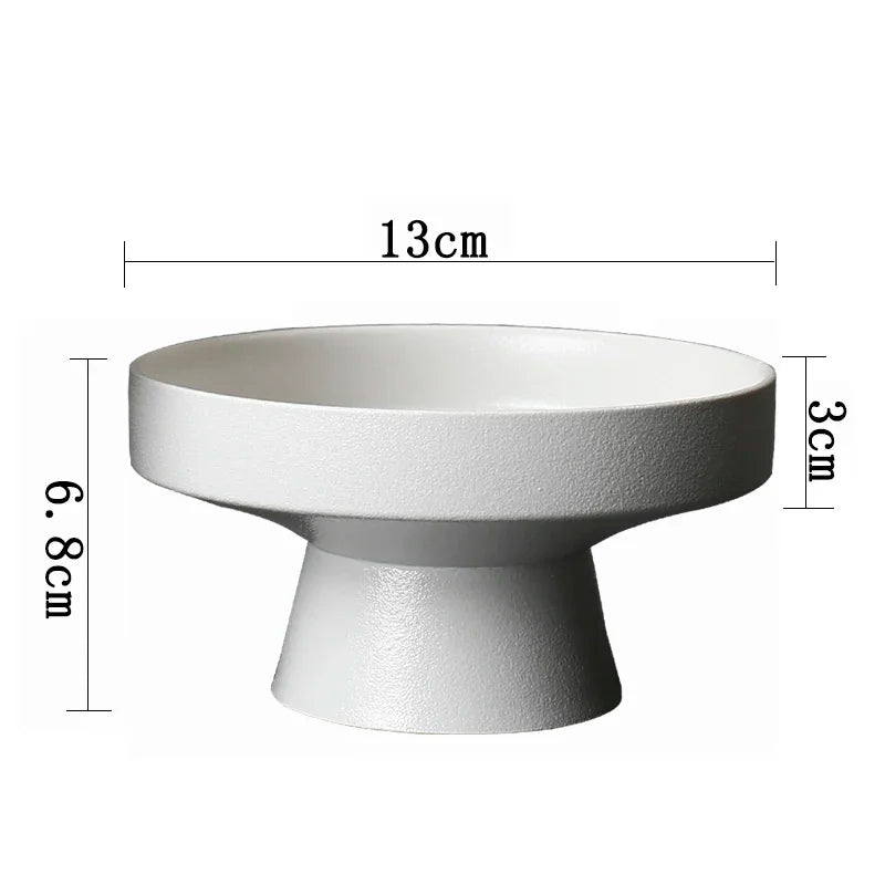 Minimalist white pedestal bowl with a textured matte finish, 13cm diameter and 6.8cm total height.