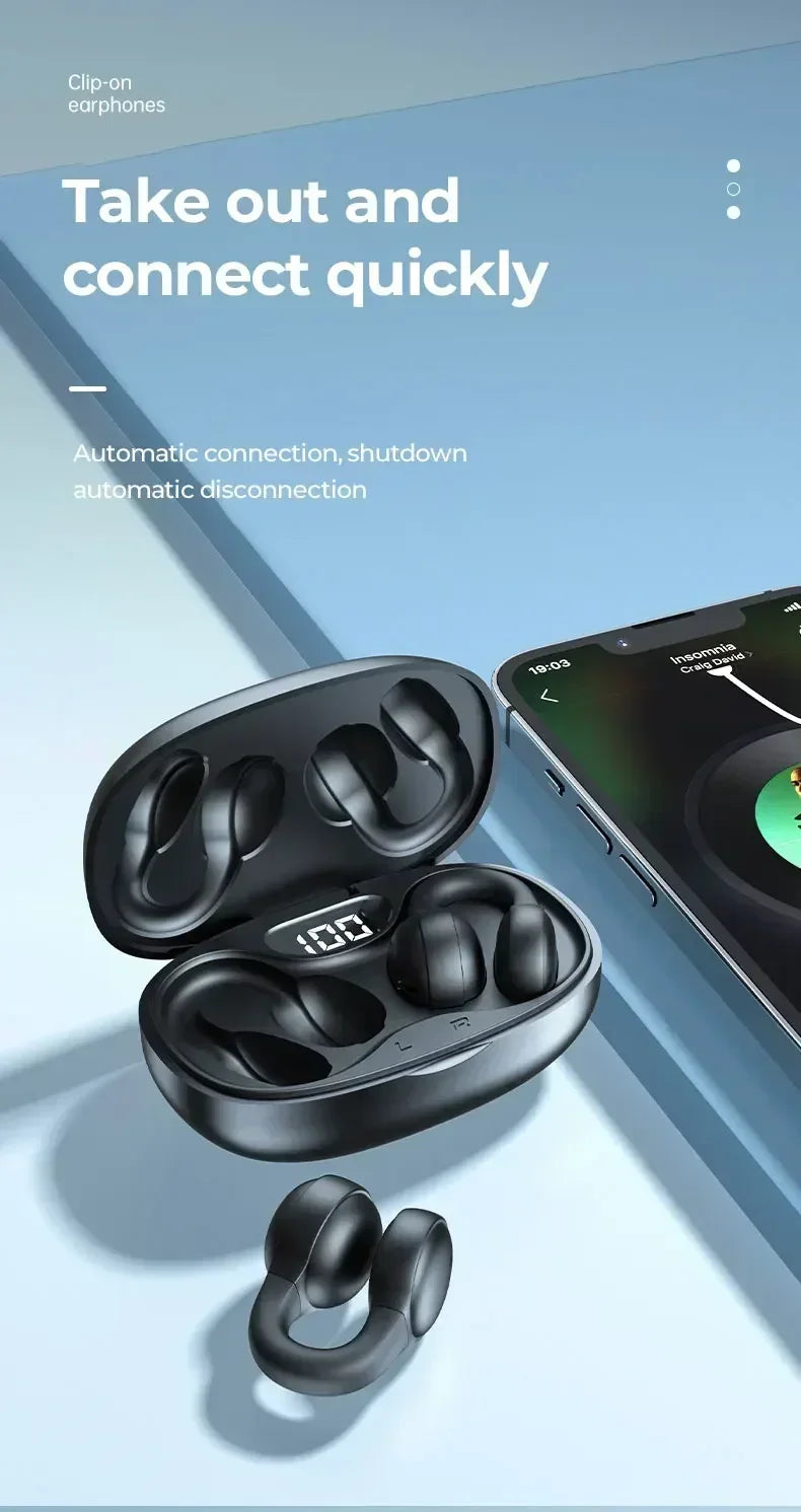 Black matte clip-on wireless earphones in a charging case with a digital battery display next to a smartphone.