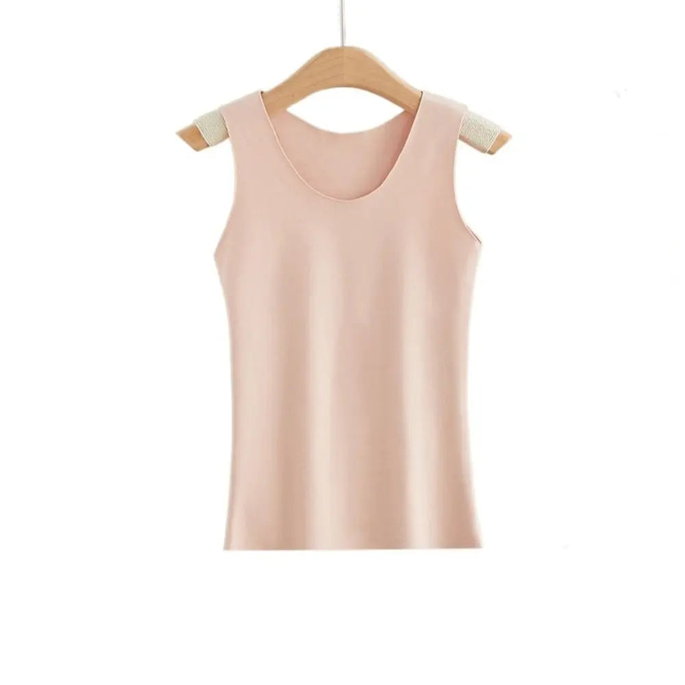 Pale pink seamless camisole vest with a scoop neckline, hanging on a wooden hanger against a white background.