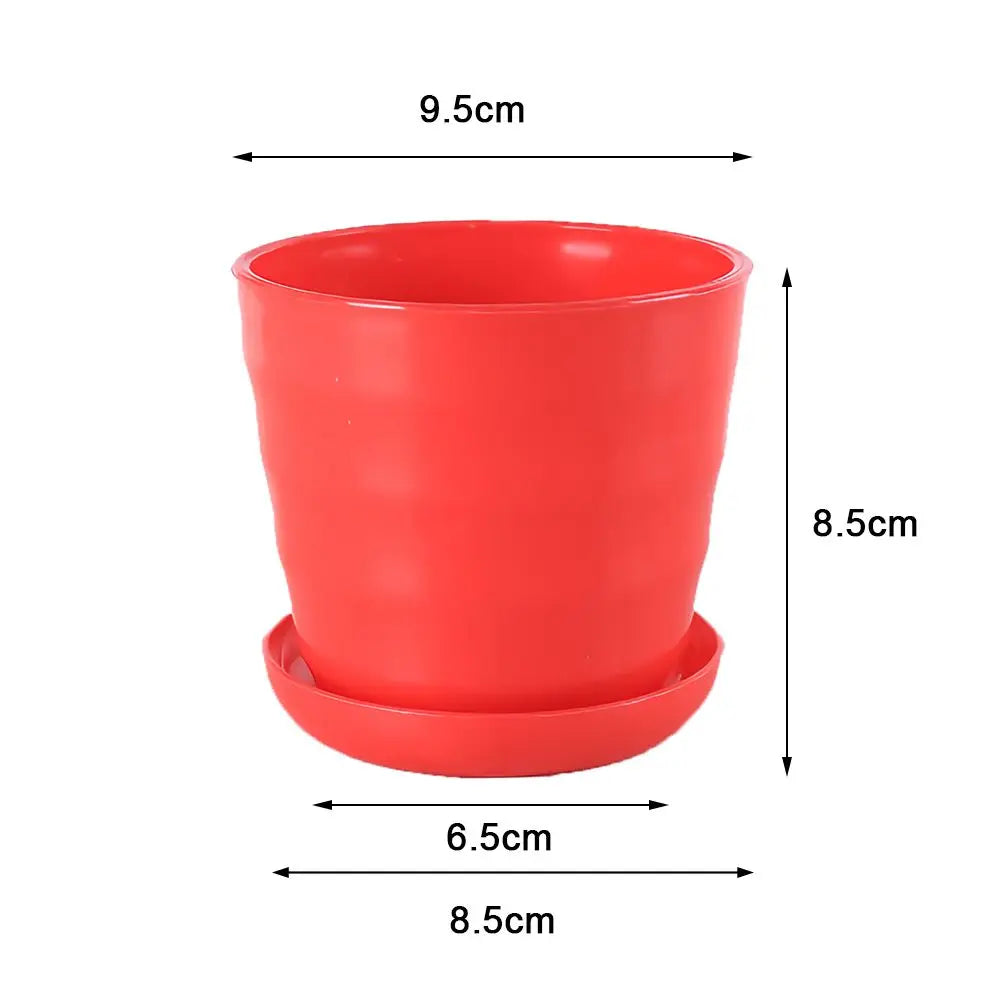 A red plastic flower pot with a matching saucer, featuring a wavy texture and dimension labels on a white background.