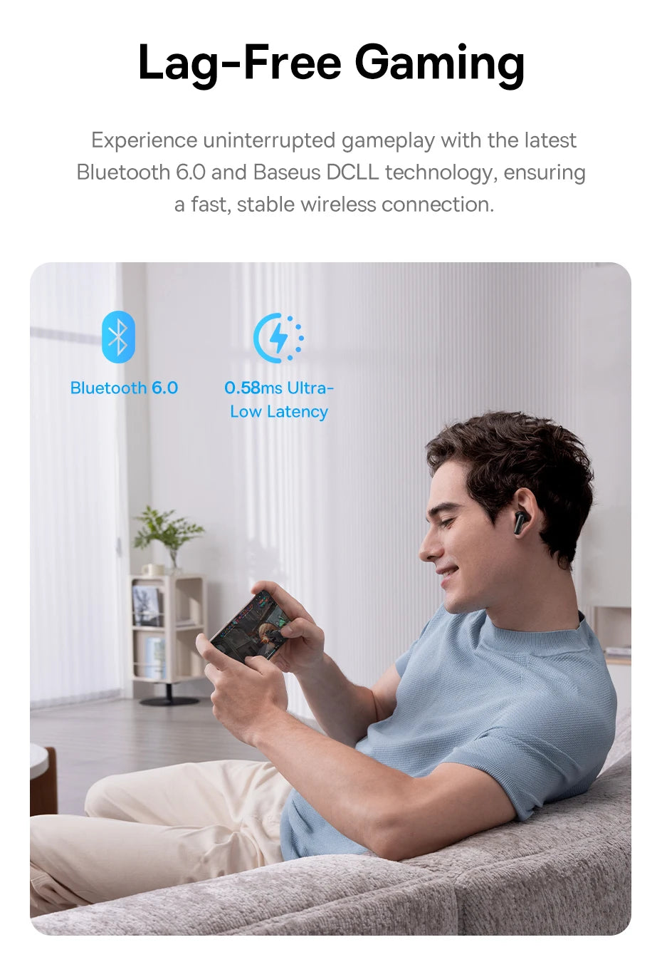 Man on a sofa playing a mobile game wearing sleek black wireless earbuds.