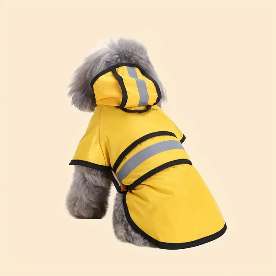 A fluffy grey dog wearing a bright yellow, waterproof raincoat with a hood and reflective grey safety stripes.