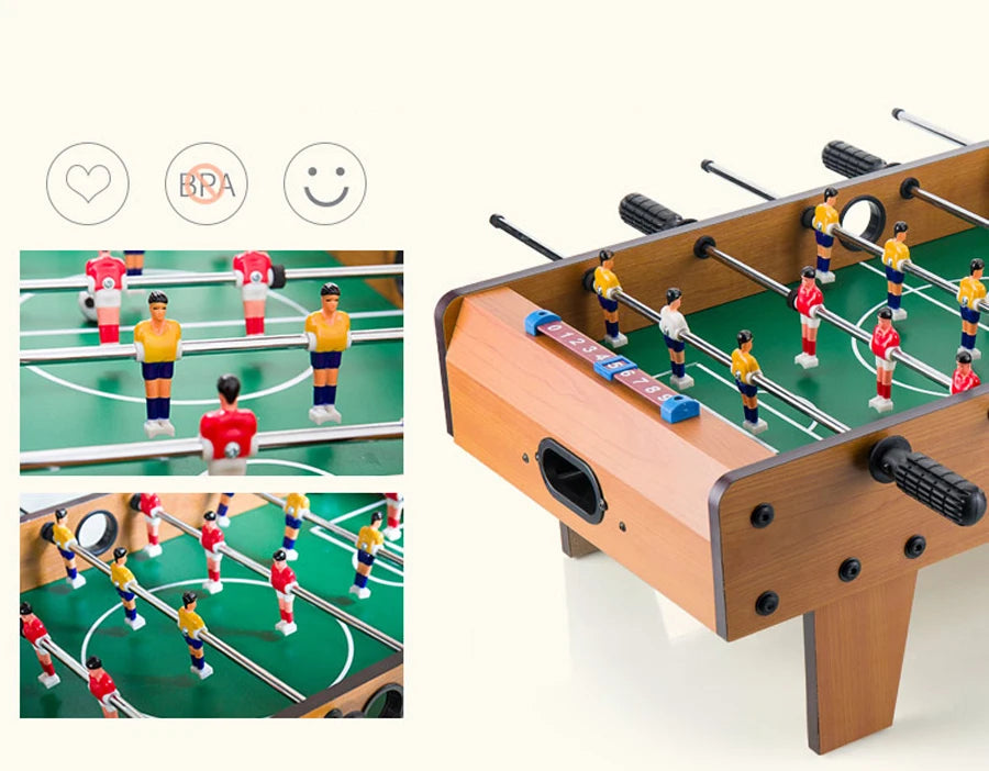 Tabletop foosball table with a wood-effect finish, green pitch, and red and yellow player figurines.