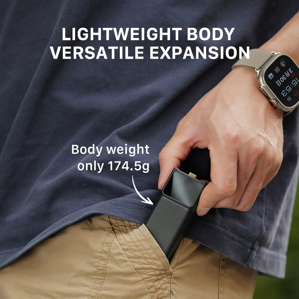A person holds a small, black handheld device being placed into a khaki pocket, with text reading "Body weight only 174.5g."