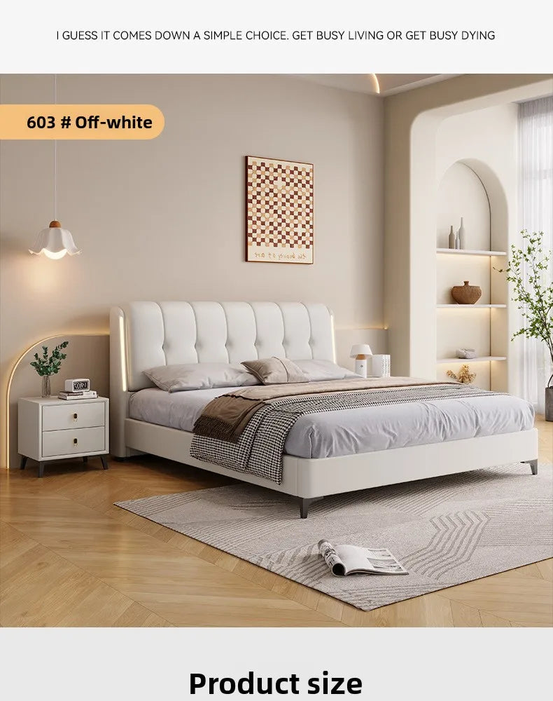 Modern minimalist cream white bed frame with a tufted headboard and integrated LED side lighting.