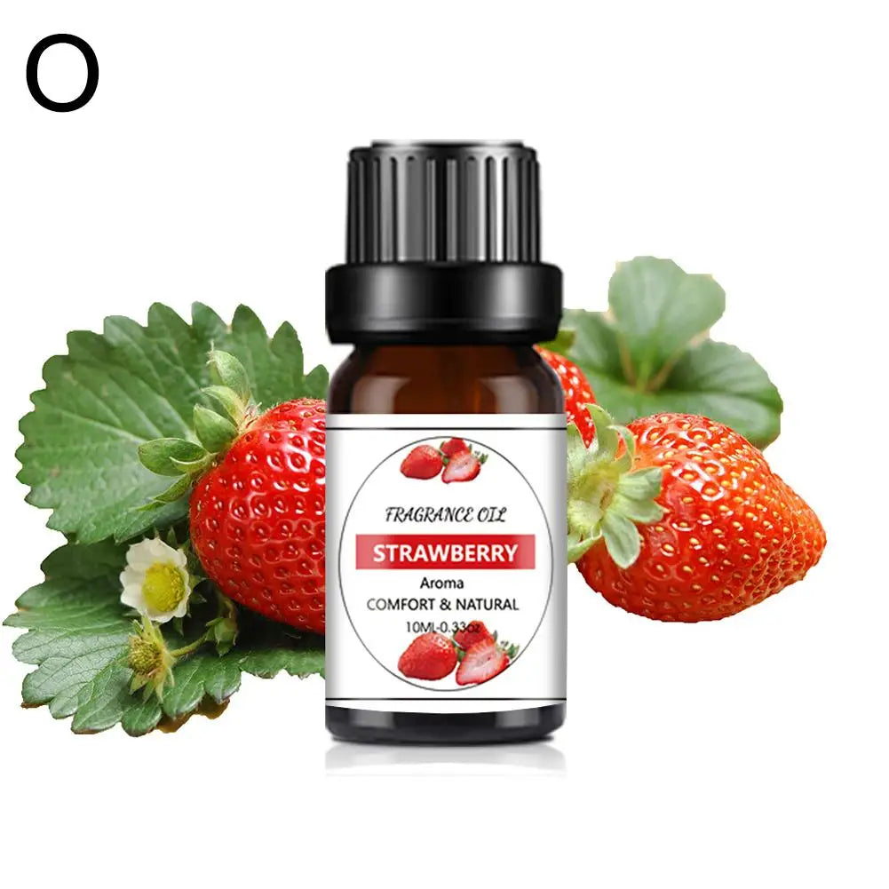 10ml brown glass bottle of strawberry fragrance oil with a black cap, surrounded by fresh strawberries and leaves.