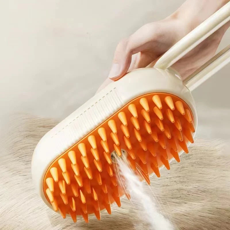 Cream pet grooming brush with orange silicone bristles, featuring a built-in water spray function.