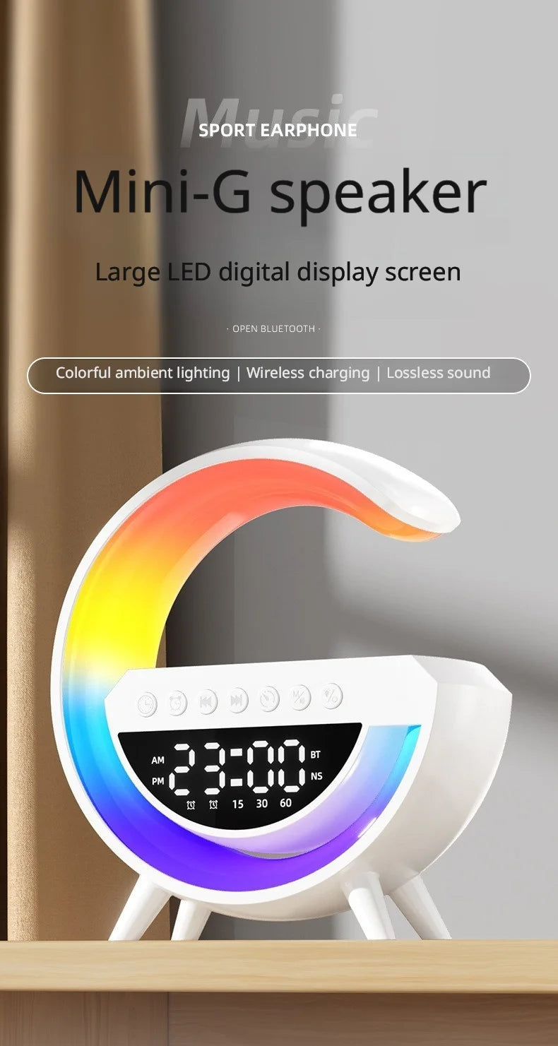 White G-shaped smart alarm clock with a vibrant rainbow LED light, digital display, and wireless charging base.