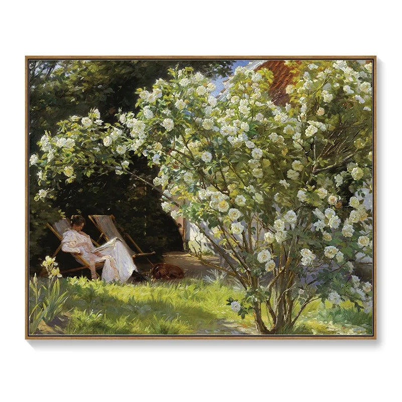 Framed wall art meter box cover featuring an impressionist garden scene with a woman reading by white rose bushes.