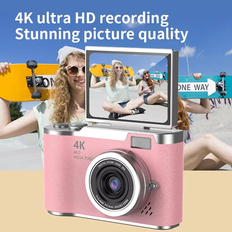 Pink 4K digital camera with textured finish, silver accents, and a flip-out screen.