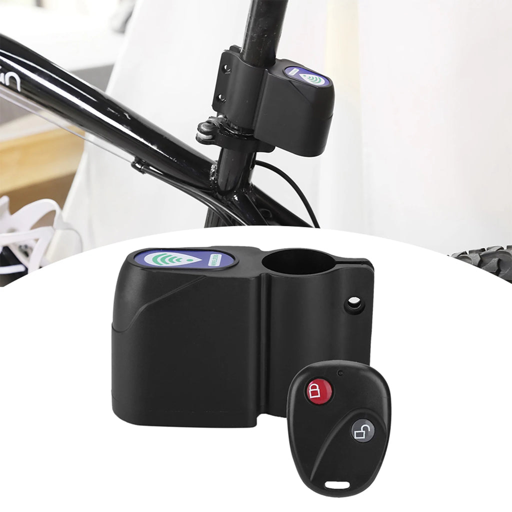 Black plastic bike frame alarm lock with a remote control, mounted on a bicycle seat post.