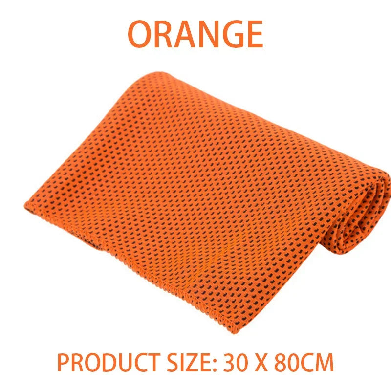 Folded orange cooling sports towel with a textured, perforated microfibre fabric.