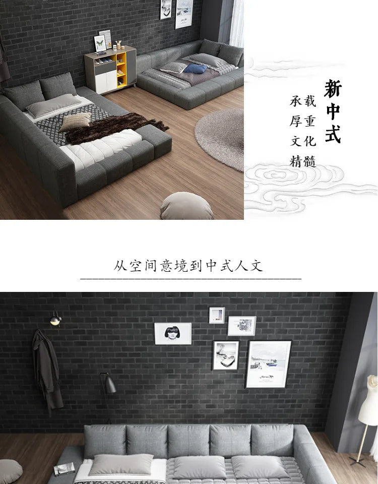 Modern grey padded double bed with a low-profile, upholstered frame and minimalist design in a contemporary setting.