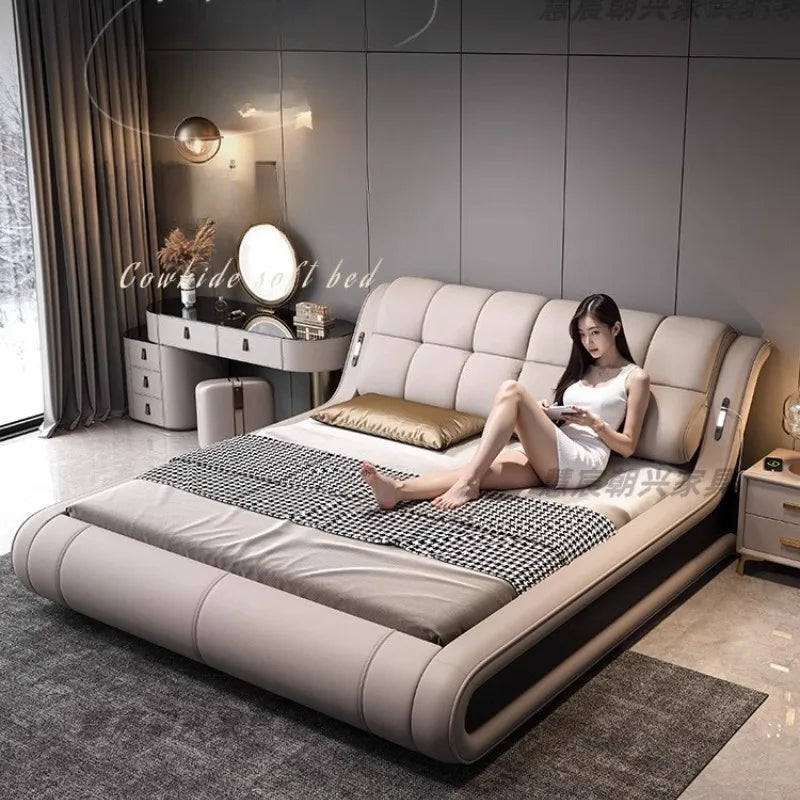 Modern beige genuine leather bed frame with a sleek, curved low-profile design and a comfortable tufted headboard.