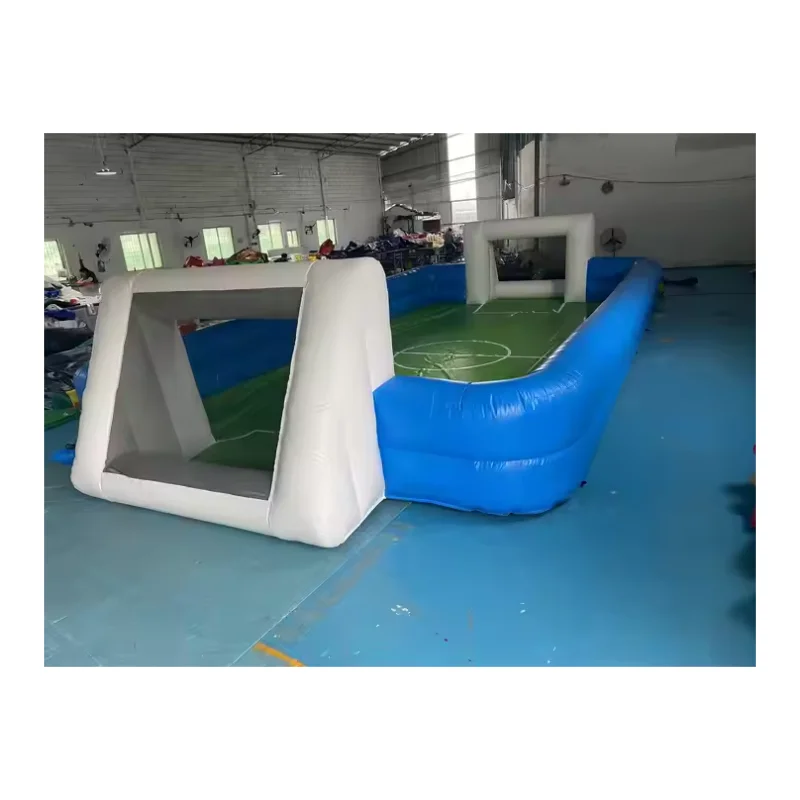 Inflatable blue and white football pitch with integrated goals and green court markings.