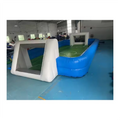 Inflatable blue and white football pitch with integrated goals and green court markings.