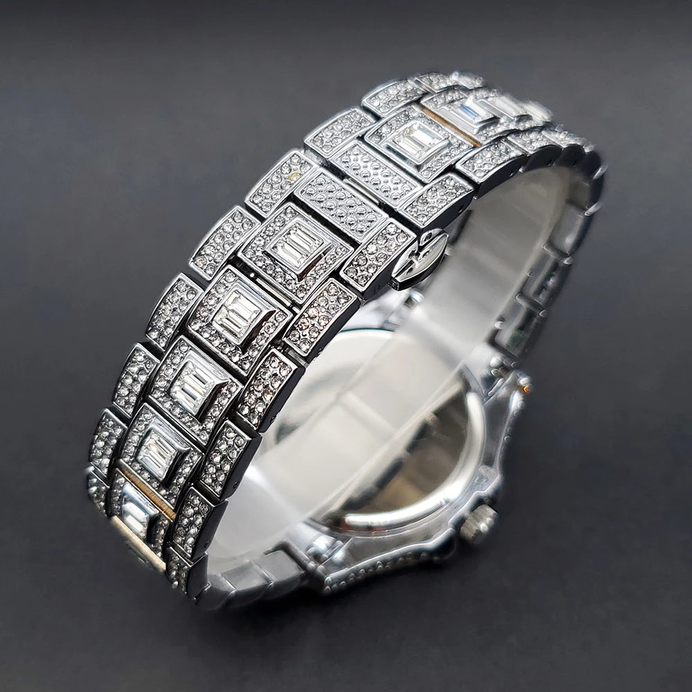 Elegant silver-tone women's dress watch with a crystal-encrusted linked bracelet and rectangular baguette-cut stones.