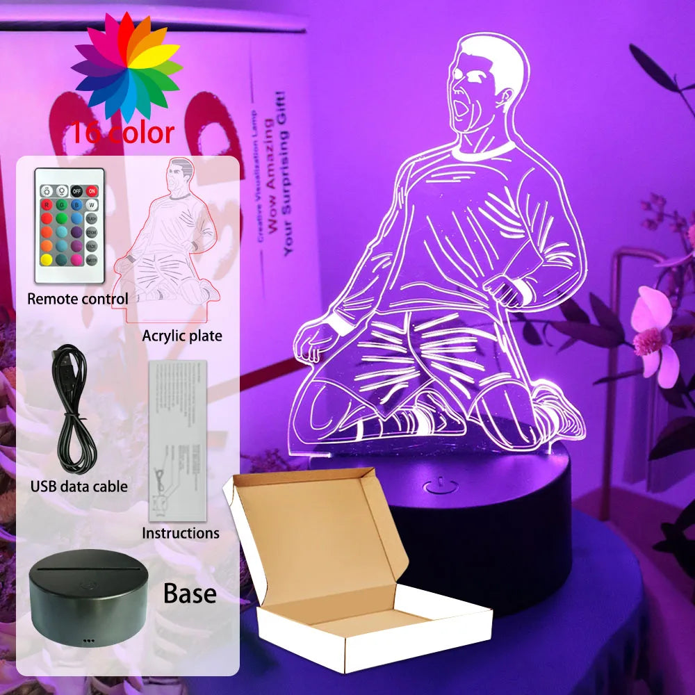 LED football player night light with 16 colour-changing options, remote control, USB cable, and black base.