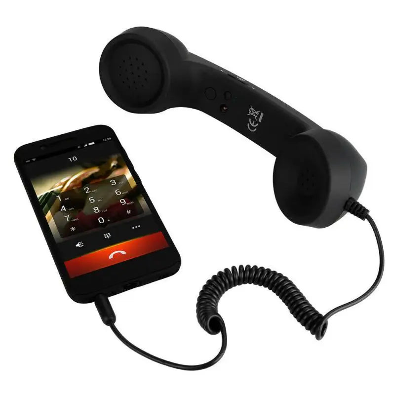Black retro-style telephone handset with a coiled cable connected to a smartphone.