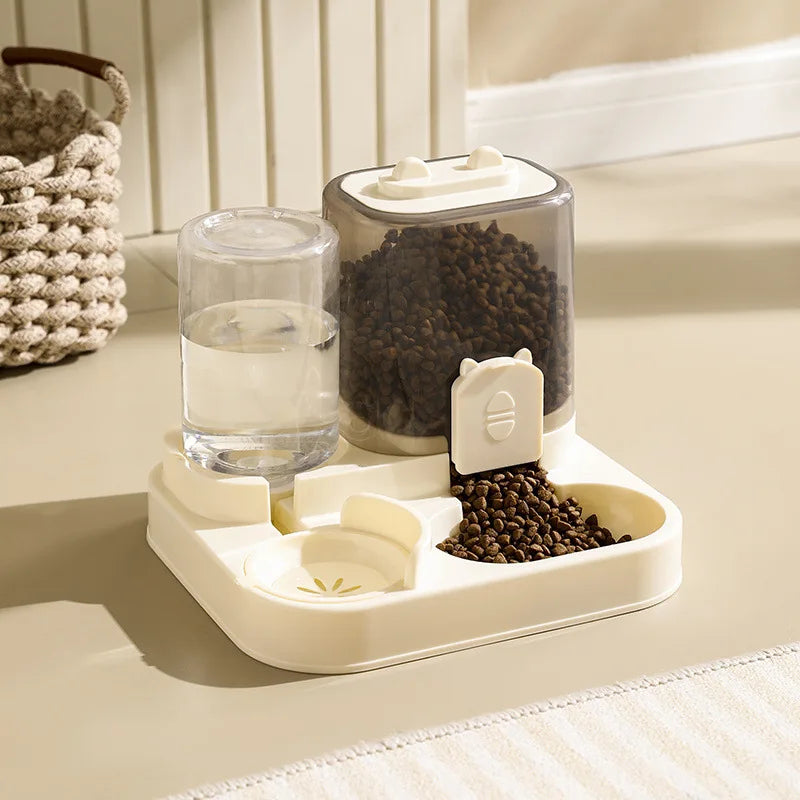Cream-coloured automatic pet feeder and water fountain with a transparent food hopper and water bottle.