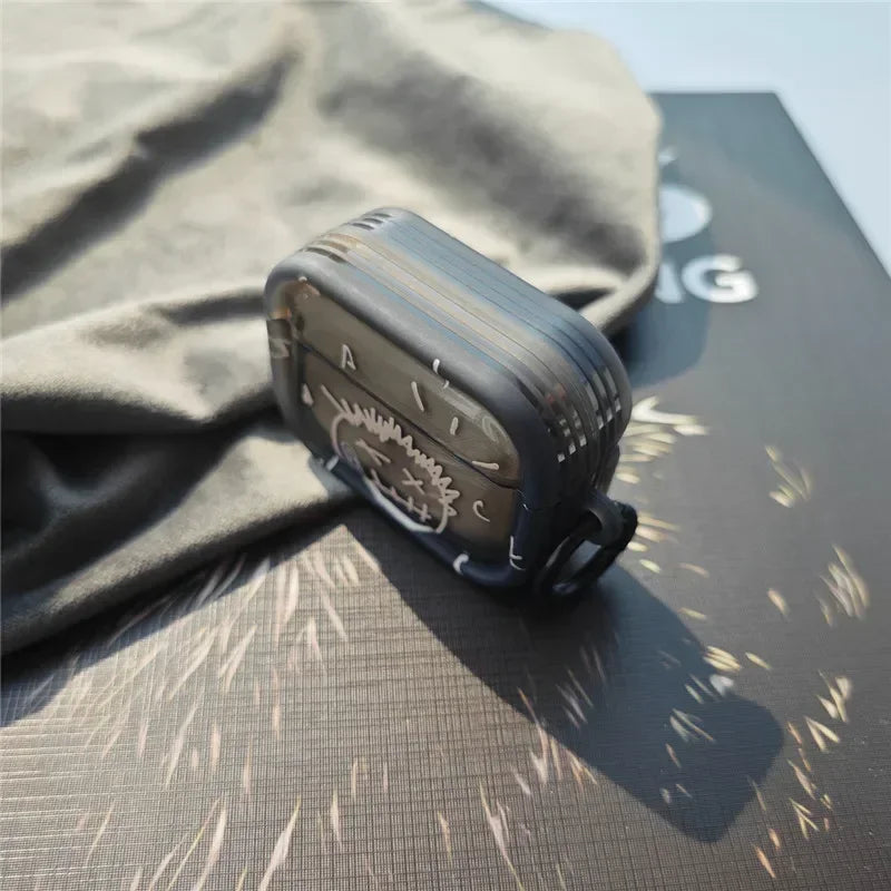 Black smoke-effect silicone AirPods Pro case with white line art graphic and integrated side hook.
