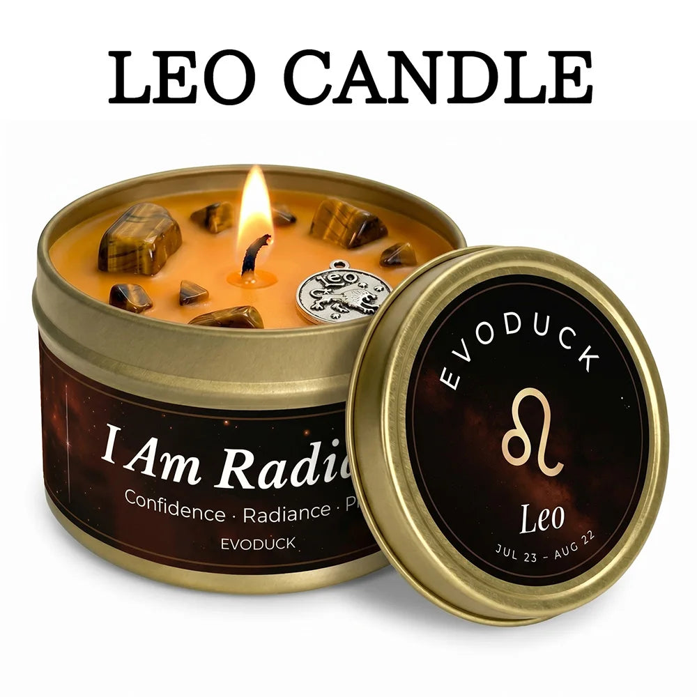 Gold tin candle with orange wax, tiger's eye crystals, a silver Leo charm, and a zodiac-themed label.