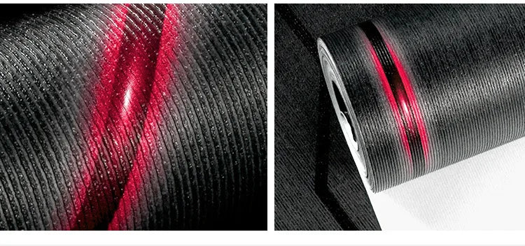 Modern black wallpaper roll with a 3D ribbed texture and a vibrant, reflective red diagonal stripe.