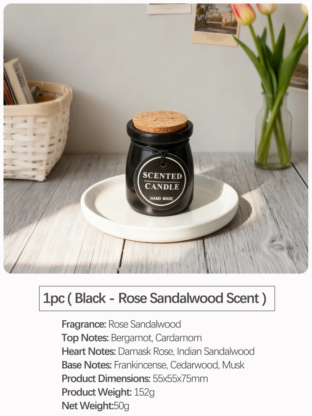 Black scented candle in a glass jar with a cork lid and tag, resting on a white ceramic plate.