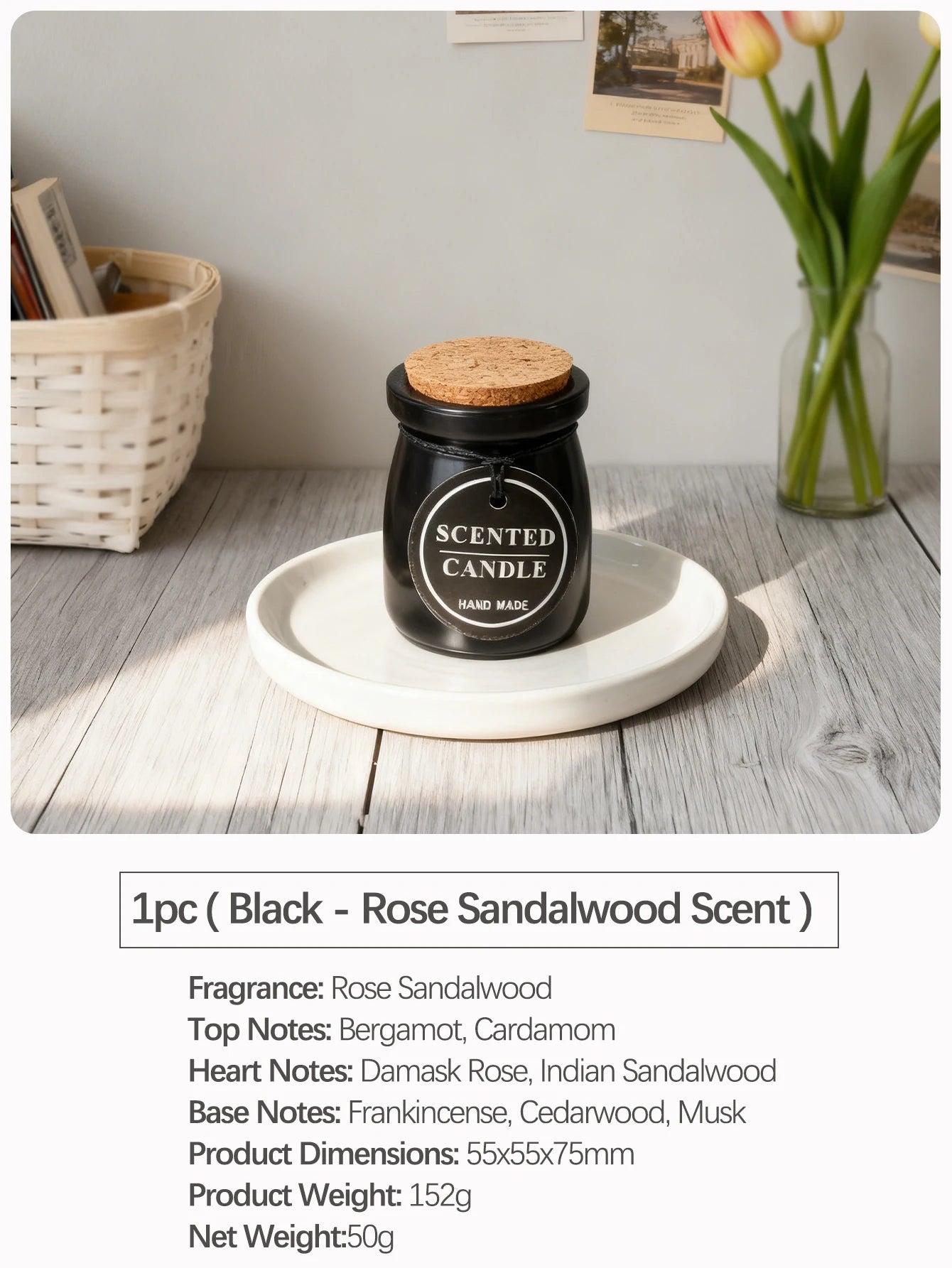 Black scented candle in a glass jar with a cork lid and tag, resting on a white ceramic plate.