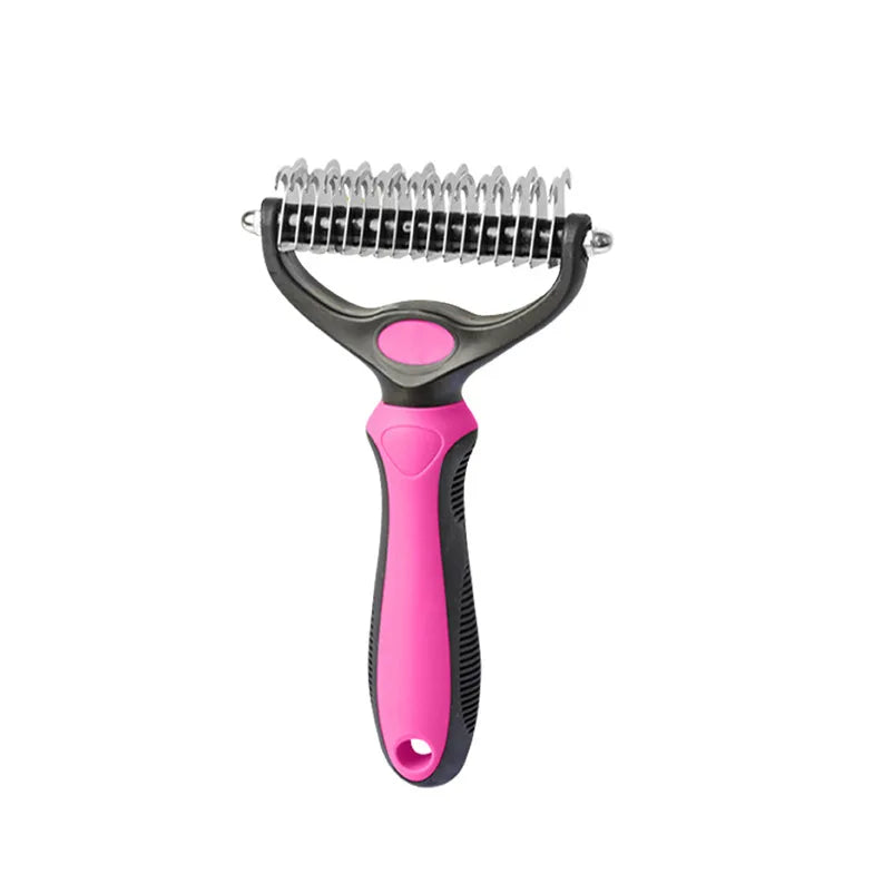 Pet grooming rake with a black and pink ergonomic handle and a stainless steel dual-sided de-shedding blade.