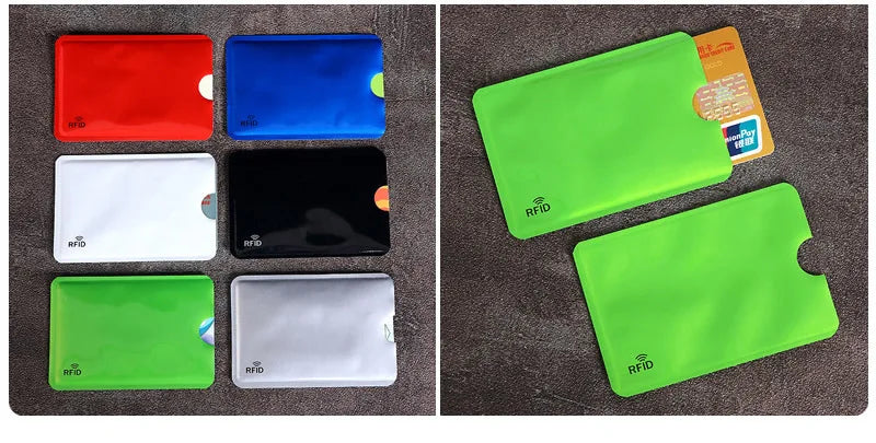 Multi-colored RFID-blocking card sleeves made of thin, flexible material, shown with a credit card inserted.