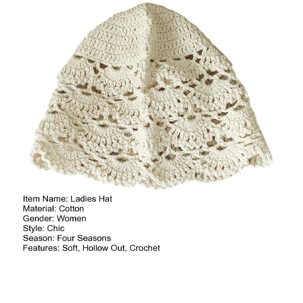 Cream-coloured women's cotton bucket hat featuring a delicate, decorative hollow crochet lace pattern.