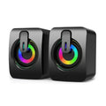 Pair of compact black USB stereo speakers featuring circular multi-coloured RGB LED light rings on the front.