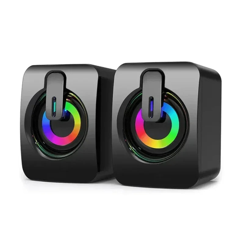 Pair of compact black USB stereo speakers featuring circular multi-coloured RGB LED light rings on the front.