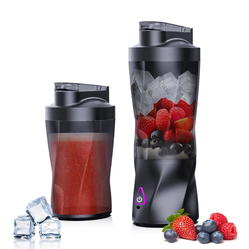 Black portable blender with a sleek base, power button, and clear cup filled with strawberries, blueberries, and ice.